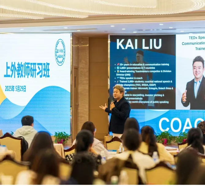 Kai leading a professional training session in front of an audience